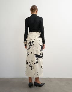 Model wearing Twill wrap tie detail maxi skirt in cow print