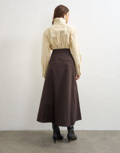 Model wearing Twill wrap waistband detail trench skirt in chocolate