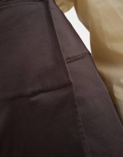 Model wearing Twill wrap waistband detail trench skirt in chocolate