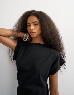 Model wearing Twist body tank in black