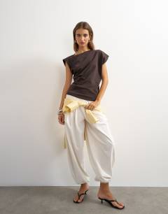 Model wearing Twist body tank in chocolate