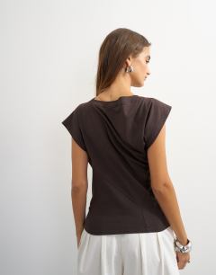 Model wearing Twist body tank in chocolate