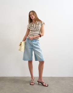 Model wearing Twist detail stripe t-shirt in ecru and chocolate