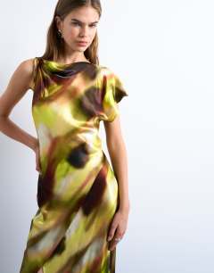 Model wearing Twist shoulder backless midi satin dress in abstract yellow print