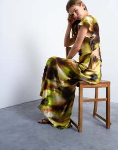 Model wearing Twist shoulder backless midi satin dress in abstract yellow print