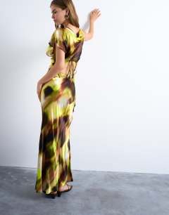 Model wearing Twist shoulder backless midi satin dress in abstract yellow print