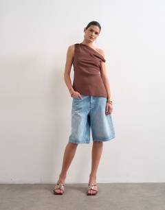 Model wearing Twist shoulder linen asymmetric top in chocolate