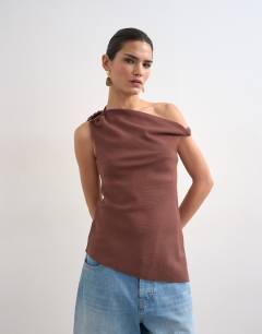Model wearing Twist shoulder linen asymmetric top in chocolate
