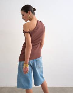 Model wearing Twist shoulder linen asymmetric top in chocolate