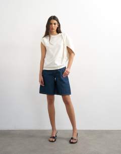 Model wearing Twist shoulder top in ivory