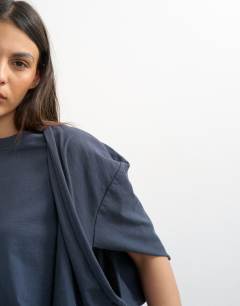 Model wearing Twist shoulder top in slate