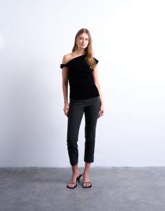 Model wearing Twist shoulder velvet top in black