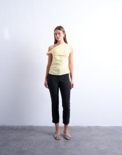 Model wearing Twist shoulder velvet top in buttermilk