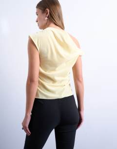 Model wearing Twist shoulder velvet top in buttermilk
