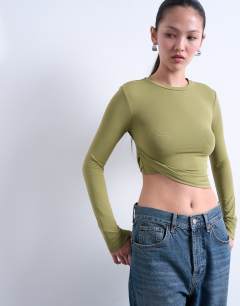 Model wearing Twist side long sleeve top in green