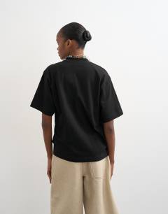 Model wearing Twist tuck tee in black