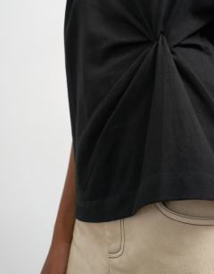 Model wearing Twist tuck tee in black