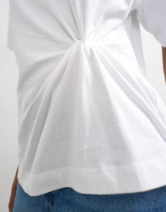 Model wearing Twist tuck tee in white