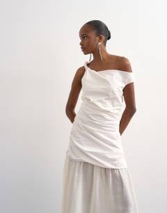 Model wearing Twisted shoulder sheer skirt midi dress in off-white