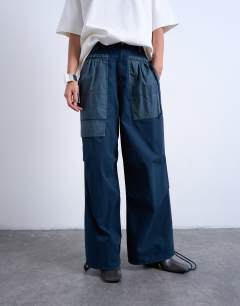 Model wearing Two toned cargo trousers with deep pockets in slate