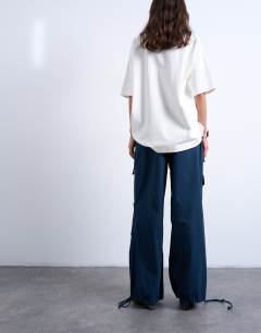 Model wearing Two toned cargo trousers with deep pockets in slate