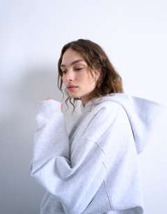 Model wearing Ultimate hoodie in ash grey