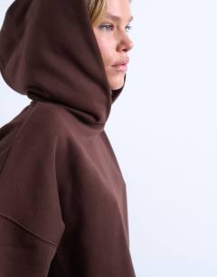 Model wearing Ultimate hoodie in chocolate brown