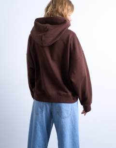 Model wearing Ultimate hoodie in chocolate brown