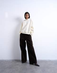 Model wearing Ultimate hoodie in ecru