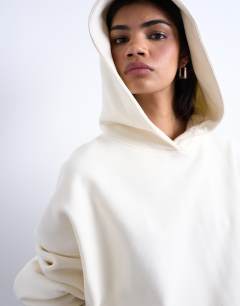 Model wearing Ultimate hoodie in ecru