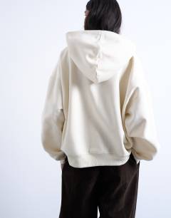 Model wearing Ultimate hoodie in ecru