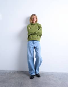 Model wearing Ultimate hoodie in green