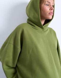 Model wearing Ultimate hoodie in green