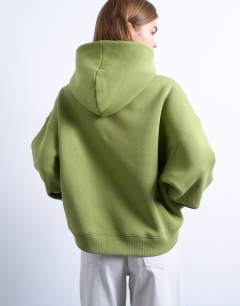 Model wearing Ultimate hoodie in green