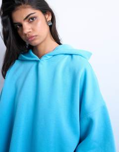Model wearing Ultimate hoodie in light blue