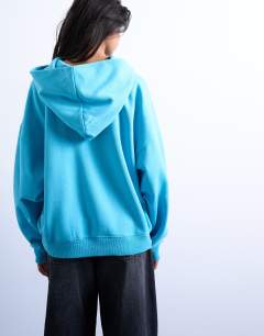 Model wearing Ultimate hoodie in light blue
