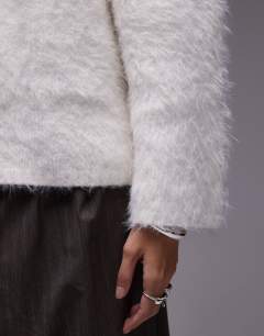 Model wearing Ultra fluffy oversized jumper in ivory