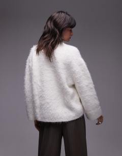Model wearing Ultra fluffy oversized jumper in ivory