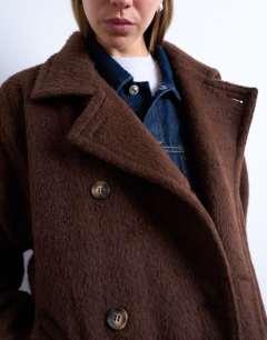 Model wearing Unlined double breasted longline coat with wool in chocolate