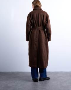 Model wearing Unlined double breasted longline coat with wool in chocolate