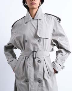 Model wearing Unlined longline nylon trench coat in grey