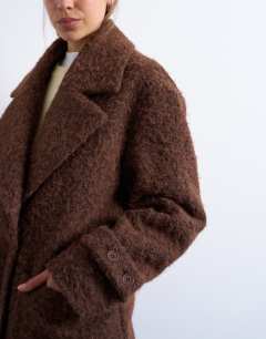 Model wearing Unlined soft brushed chuck on longline coat in brown