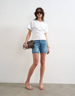 Model wearing V-neck cinch in white