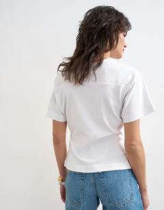 Model wearing V-neck cinch tee in white
