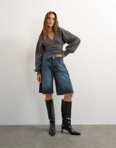 Model wearing V-neck cinch waist sweat in black