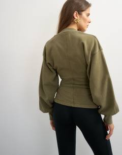 Model wearing V-neck cinch waist sweat in khaki