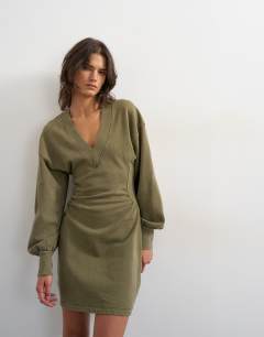 Model wearing V-neck cinch waist sweat mini dress in khaki