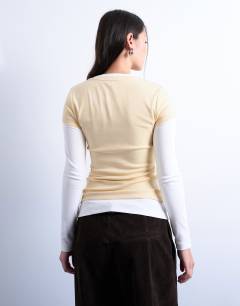 Model wearing V-neck double layer long sleeve top in buttermilk and ecru