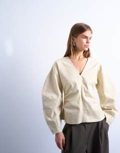 V neck ovoid sleeve top in cream