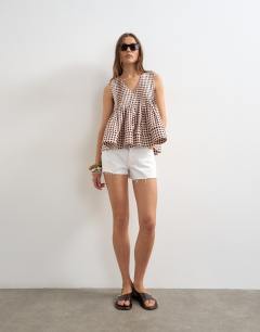 Model wearing V neck pintuck detail a line top in gingham check 